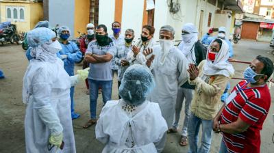 Indore was where health personnel were attacked while doing a survey last week. Here, residents of the Taat Patti Bakhal locality apologize to a team of doctors a day after health workers were attacked by some local people. (PTI)