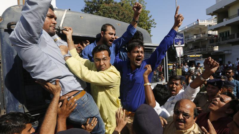Congress activists shout slogans after being detained during a protest against the government's decision to withdraw high denomination notes from circulation, in Ahmadabad. (Photo: AP) Congress activists shout slogans after being detained during a protest against the government's decision to withdraw high denomination notes from circulation, in Ahmadabad. (Photo: AP)