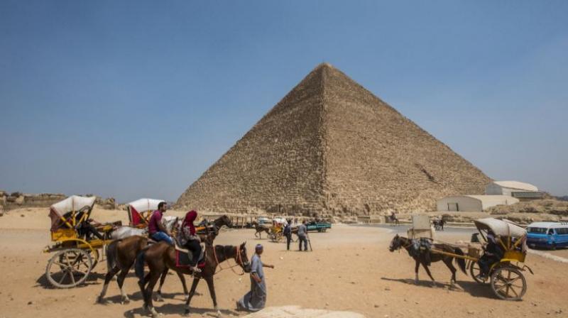 Egyptians ride their carts past the Great Pyramid of Cheops, aka Pyramid of Khufu, on August 31, 2016 on the Giza Plateau. (Photo: AFP) Egyptians ride their carts past the Great Pyramid of Cheops, aka Pyramid of Khufu, on August 31, 2016 on the Giza Plateau. (Photo: AFP)