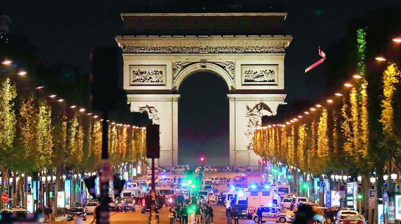 Police officers block the access to the Champs Elysees in Paris after a shooting on late Thursday night. (Photo: AFP) Police officers block the access to the Champs Elysees in Paris after a shooting on late Thursday night. (Photo: AFP)