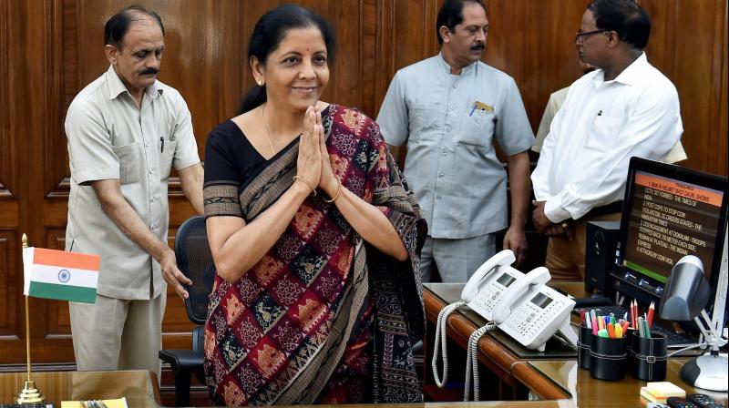 Defence Minister Nirmala Sitharaman takes charge at her office in New Delhi on Thursday, becoming the first full-time woman Defence Minister of the country. (Photo: PTI) Defence Minister Nirmala Sitharaman takes charge at her office in New Delhi on Thursday, becoming the first full-time woman Defence Minister of the country. (Photo: PTI)
