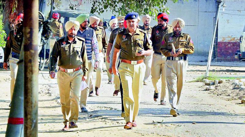 Police officials investigate after six inmates of Nabha Jail near Patiala escape on Sunday. (Photo: PTI) Police officials investigate after six inmates of Nabha Jail near Patiala escape on Sunday. (Photo: PTI)