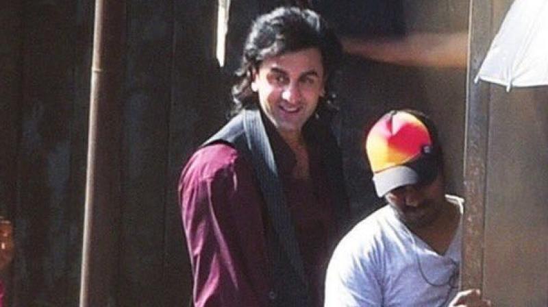 Ranbir Kapoor snapped with long locks while shooting in Mumbai for Rajkumar Hirani's biopic on Sanjay Dutt. Ranbir Kapoor snapped with long locks while shooting in Mumbai for Rajkumar Hirani's biopic on Sanjay Dutt.