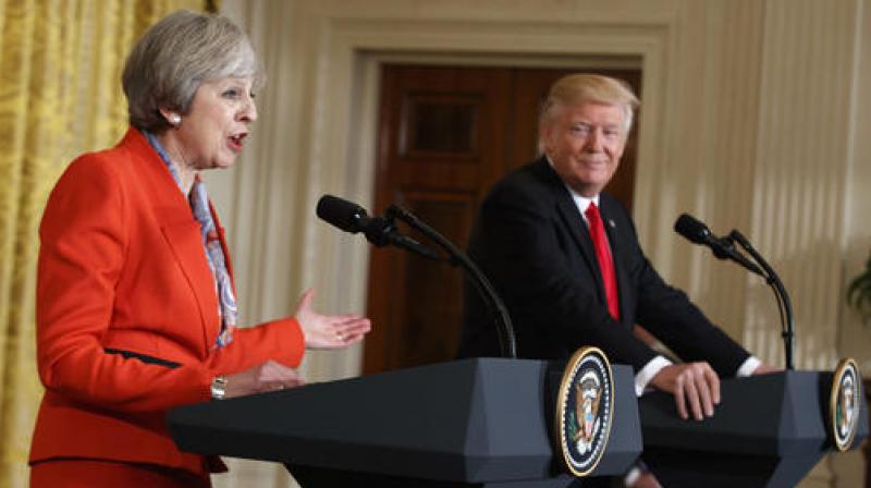 President Donald Trump listens as British Prime Minister Theresa May speaks during a news conference in the East Room of the White House in Washington. (Photo: AP) President Donald Trump listens as British Prime Minister Theresa May speaks during a news conference in the East Room of the White House in Washington. (Photo: AP)