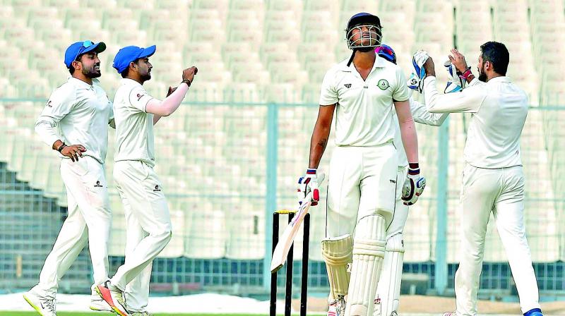 Karnataka players celebrate the wicket of Vidarbha batsman Apoorv Wankhade during the Ranji Trophy semifinal in Kolkata. (Photo: PTI) Karnataka players celebrate the wicket of Vidarbha batsman Apoorv Wankhade during the Ranji Trophy semifinal in Kolkata. (Photo: PTI)