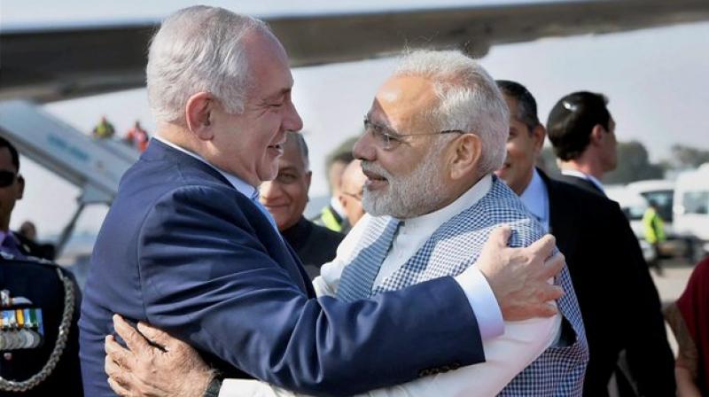 Prime Minister Narendra Modi welcomes Israeli Prime Minister Benjamin Netanyahu on his arrival at Air Force Station, Palam, in New Delhi on Sunday. (Photo: PTI) Prime Minister Narendra Modi welcomes Israeli Prime Minister Benjamin Netanyahu on his arrival at Air Force Station, Palam, in New Delhi on Sunday. (Photo: PTI)