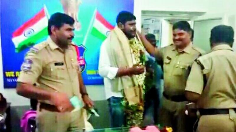 Police personnel celebrate the birthday of contractor Ravinder Reddy inside the police station at Manakondur village in Karimangar on Saturday. Police personnel celebrate the birthday of contractor Ravinder Reddy inside the police station at Manakondur village in Karimangar on Saturday.