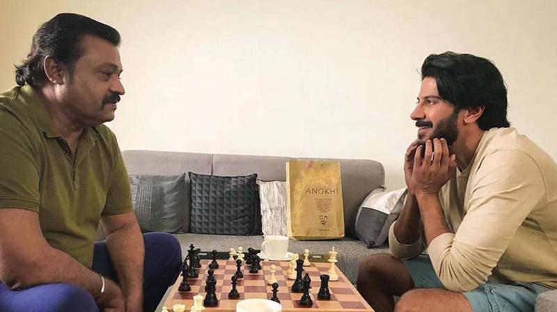 DQ took to his Instagram handle and shared a candid picture of him playing chess with Suresh Gopi. DQ took to his Instagram handle and shared a candid picture of him playing chess with Suresh Gopi.