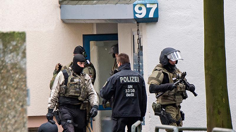 Police in the eastern region of Thuringia said that they searched 13 dwellings in five regions as part of an investigation into a 28-year-old Russian citizen of Chechen background suspected of intending to join the fighting in Syria on behalf of the Islamic State group. (Photo: Representational Image/AP) Police in the eastern region of Thuringia said that they searched 13 dwellings in five regions as part of an investigation into a 28-year-old Russian citizen of Chechen background suspected of intending to join the fighting in Syria on behalf of the Islamic State group. (Photo: Representational Image/AP)