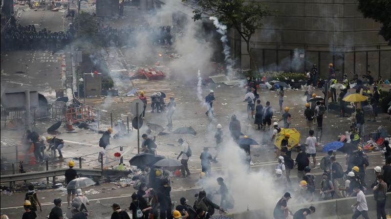 Police fired rubber bullets and beanbag rounds at the crowds, weapons that have not been widely used in recent history. Human rights groups criticised the tough tactics, while police said they were necessary against crowds of people who broke through barriers outside government headquarters and the legislature on Wednesday. (Photo: AP) Police fired rubber bullets and beanbag rounds at the crowds, weapons that have not been widely used in recent history. Human rights groups criticised the tough tactics, while police said they were necessary against crowds of people who broke through barriers outside government headquarters and the legislature on Wednesday. (Photo: AP)