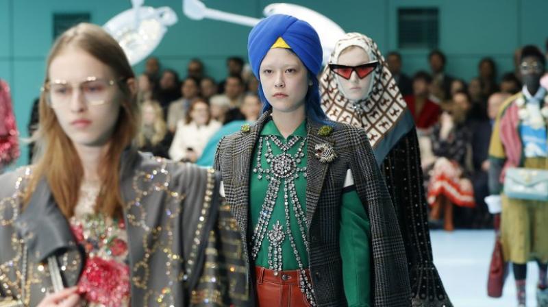 The singer and company said they were saddened it was being compared to blackface and said the designs rather were envisioned as a nod to 'modern art and surrealism.' (Photo: AP) The singer and company said they were saddened it was being compared to blackface and said the designs rather were envisioned as a nod to 'modern art and surrealism.' (Photo: AP)