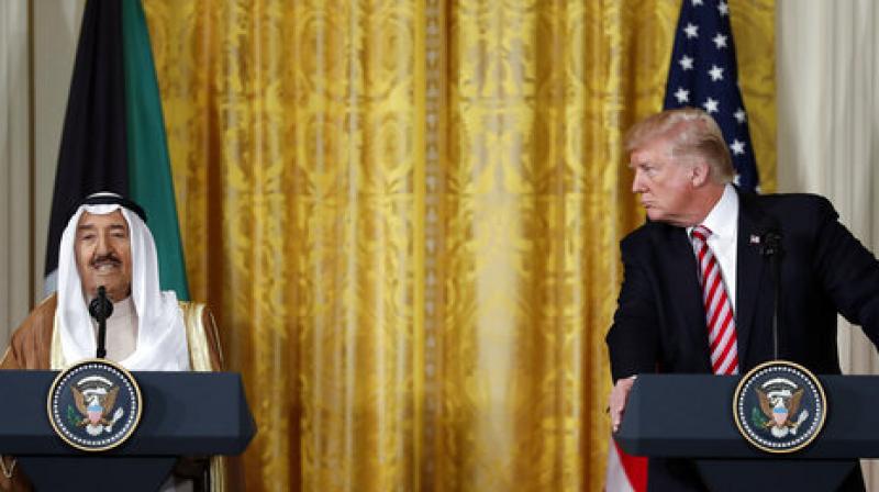 President Donald Trump looks to Emir of Kuwait Sheikh Sabah Al Ahmad Al Sabah as he speaks during a news conference in the East Room of the White House in Washington (Photo: AP) President Donald Trump looks to Emir of Kuwait Sheikh Sabah Al Ahmad Al Sabah as he speaks during a news conference in the East Room of the White House in Washington (Photo: AP)