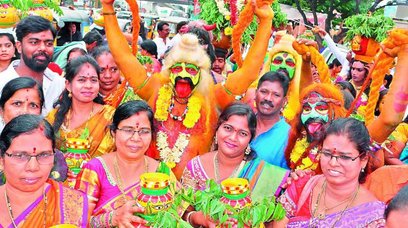 With OgguDolu, Dappulu, Kolatam, folk songs and orchestra, IT corridor came to fresh life with Bonalu celebrations and the procession. With OgguDolu, Dappulu, Kolatam, folk songs and orchestra, IT corridor came to fresh life with Bonalu celebrations and the procession.