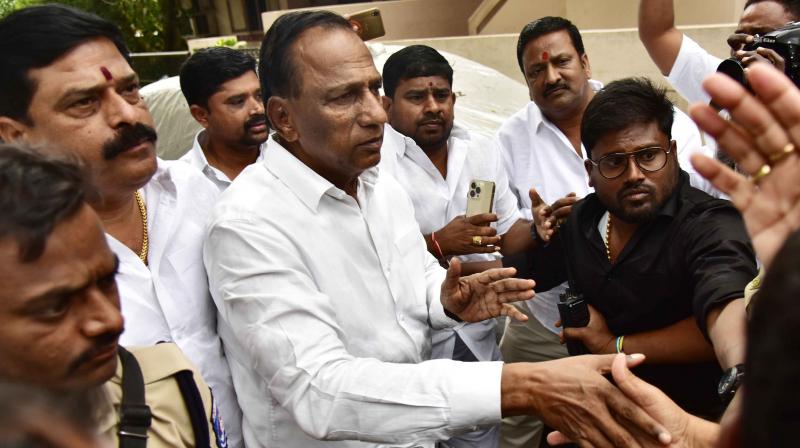 Telangana state minister Chamakura Malla Reddy greets people outside his residence after visiting his nephew Praveen and son Mahender Reddy at the hospital in Hyderabad. (S. Surender Reddy/DC)