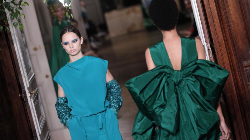 Clashing textures with silks, woollen fringes and pom poms also gave the outfits a subtle complexity. (Photo: AP) Clashing textures with silks, woollen fringes and pom poms also gave the outfits a subtle complexity. (Photo: AP)