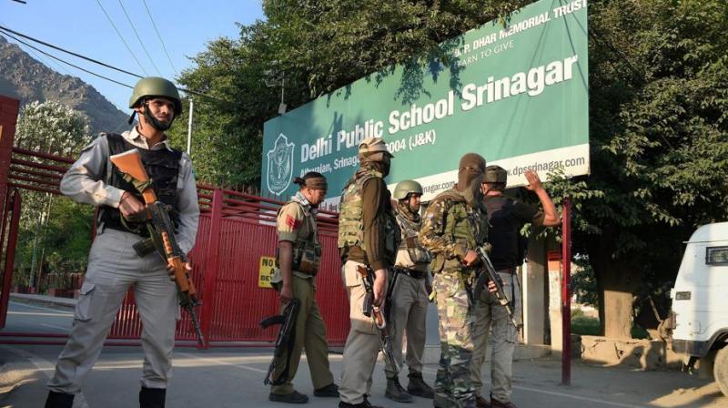 Special task force of police positioned outside a school during search operation after the CRPF vehicle was attacked by militants at Pantha Chowk in Srinagar. (Photo: PTI) Special task force of police positioned outside a school during search operation after the CRPF vehicle was attacked by militants at Pantha Chowk in Srinagar. (Photo: PTI)