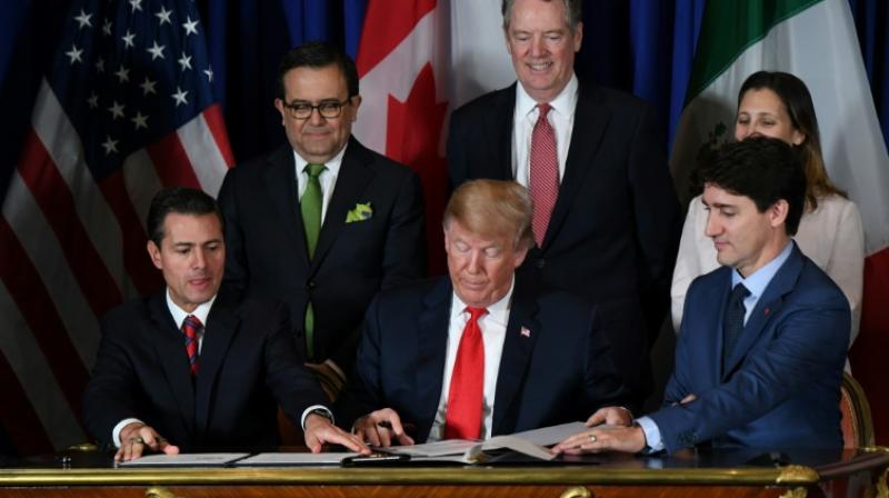The USMCA - the new NAFTA trade agreement - was signed in Buenos Aires on November 30, 2018 by (L to R) Mexican President Enrique Pena Nieto, US President Donald Trump and Canadian Prime Minister Justin Trudeau. (Photo: AFP) The USMCA - the new NAFTA trade agreement - was signed in Buenos Aires on November 30, 2018 by (L to R) Mexican President Enrique Pena Nieto, US President Donald Trump and Canadian Prime Minister Justin Trudeau. (Photo: AFP)