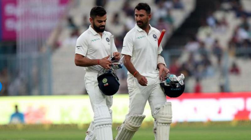 India skipper Virat Kohli and Test specialist Cheteshwar Pujara held on to their second and seventh position respectively in the latest ICC Test Player Rankings released on Wednesday. (Photo: BCCI) India skipper Virat Kohli and Test specialist Cheteshwar Pujara held on to their second and seventh position respectively in the latest ICC Test Player Rankings released on Wednesday. (Photo: BCCI)
