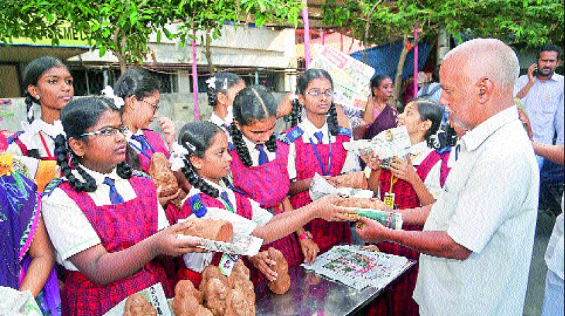 Children of Pollocks School distribute clay Ganesh idols to the people on the eve of Vinayak Chaturthi celebrations in Visakhapatnam on Tuesday. (Photo: DC) Children of Pollocks School distribute clay Ganesh idols to the people on the eve of Vinayak Chaturthi celebrations in Visakhapatnam on Tuesday. (Photo: DC)