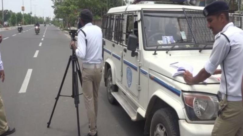 To curb the menace of rash driving on roads, Gujarat police has equipped its traffic unit with high-tech laser guns for detection of overspeeding by vehicles in the city. (Photo: ANI) To curb the menace of rash driving on roads, Gujarat police has equipped its traffic unit with high-tech laser guns for detection of overspeeding by vehicles in the city. (Photo: ANI)