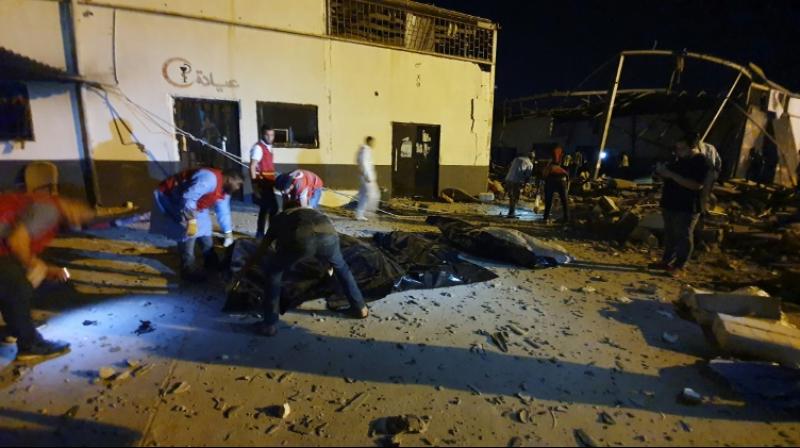 Bodies were strewn on the floor of a hangar in the Tripoli suburb of Tajoura, mixed with the blood-soaked clothes of migrants, an AFP photographer said. (Photo: AFP) Bodies were strewn on the floor of a hangar in the Tripoli suburb of Tajoura, mixed with the blood-soaked clothes of migrants, an AFP photographer said. (Photo: AFP)