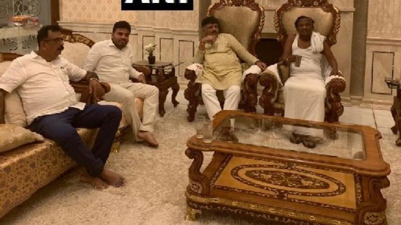 Amid ongoing political turmoil in Karnataka, Congress leader D K Shivakumar visited the residence of Congress MLA and state minister MTB Nagaraj early on Saturday morning to convince him to take back his resignation. (Photo: Twitter/ ANI) Amid ongoing political turmoil in Karnataka, Congress leader D K Shivakumar visited the residence of Congress MLA and state minister MTB Nagaraj early on Saturday morning to convince him to take back his resignation. (Photo: Twitter/ ANI)