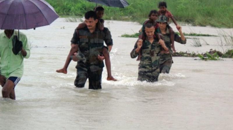 A large scale flood relief operation by the Indian Army troops is underway in flood-hit areas of lower Assam since 11 June after the torrential rain hit the region. (Photo: ANI) A large scale flood relief operation by the Indian Army troops is underway in flood-hit areas of lower Assam since 11 June after the torrential rain hit the region. (Photo: ANI)