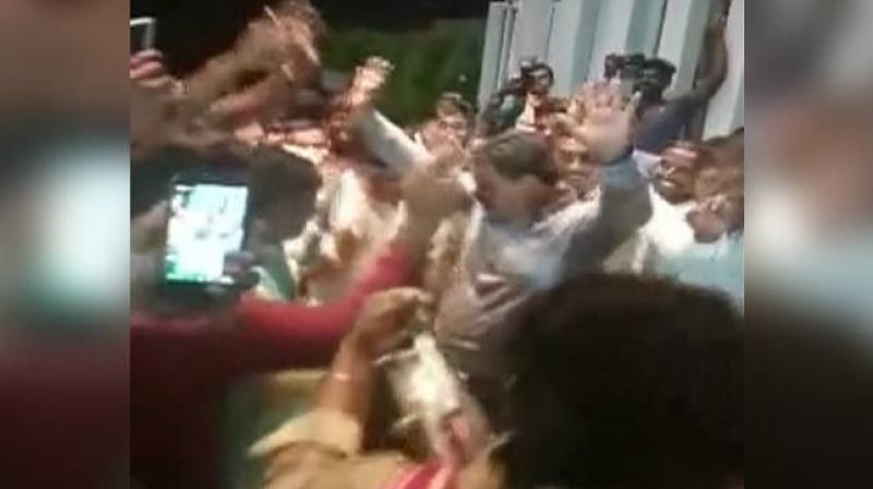 BJP legislator Renukacharya was seen dancing with his supporters in Bengaluru soon after the Congress- JD(S) coalition government in Karnataka lost the floor test on Tuesday evening. (Photo: Twitter/ ANI screengranb) BJP legislator Renukacharya was seen dancing with his supporters in Bengaluru soon after the Congress- JD(S) coalition government in Karnataka lost the floor test on Tuesday evening. (Photo: Twitter/ ANI screengranb)