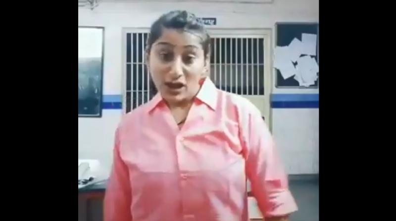 A young police woman from Gujarat has been suspended on Wednesday after a video of her dancing inside a police station to a song became viral on social media, officials said. (Photo: screengrab) A young police woman from Gujarat has been suspended on Wednesday after a video of her dancing inside a police station to a song became viral on social media, officials said. (Photo: screengrab)