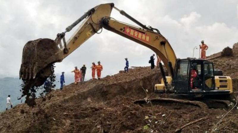 The death toll in a landslide which buried a village in southwest China rose to 29, according to state media, with 22 still missing days after the disaster struck. (Photo: AP) The death toll in a landslide which buried a village in southwest China rose to 29, according to state media, with 22 still missing days after the disaster struck. (Photo: AP)