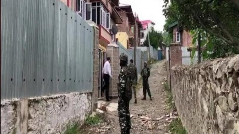 Raids by the National Investigation Agency (NIA) were underway on Sunday at locations of four businessmen in Baramulla district of North Kashmir, sources said. (Photo: ANI) Raids by the National Investigation Agency (NIA) were underway on Sunday at locations of four businessmen in Baramulla district of North Kashmir, sources said. (Photo: ANI)