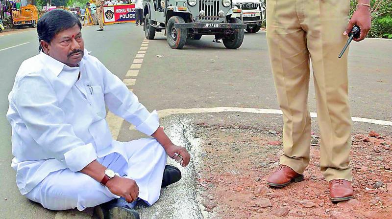 Palasa MLA Syamsundar Sivaji sits on the road at Undavalli Karakatta in protest against police stopping his car to give way to the CM’s convoy. Palasa MLA Syamsundar Sivaji sits on the road at Undavalli Karakatta in protest against police stopping his car to give way to the CM’s convoy.