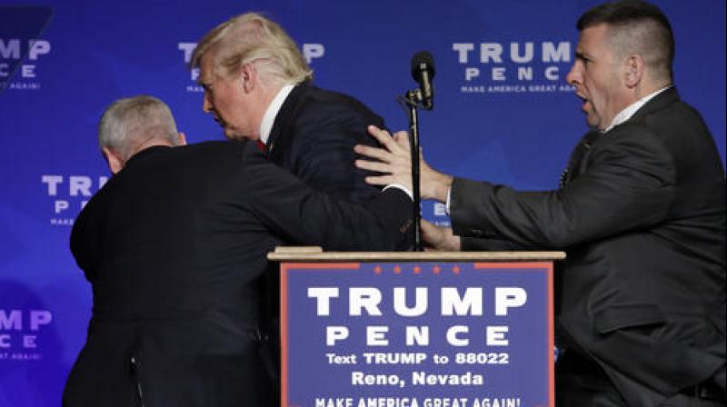 Secret Service agents rush Republican presidential candidate Donald Trump off the stage at a campaign rally in Reno, Nevada. (Photo: AP) Secret Service agents rush Republican presidential candidate Donald Trump off the stage at a campaign rally in Reno, Nevada. (Photo: AP)