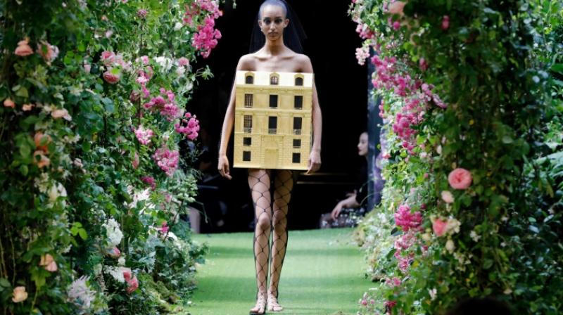 On a day when women creators dominated the Paris catwalks, the Dutch designer Iris van Herpen also sheared off her heels, cantilevering the stilettos that went with her stunning ethereal creations which are unlike anything else in fashion. (Photo: AP) On a day when women creators dominated the Paris catwalks, the Dutch designer Iris van Herpen also sheared off her heels, cantilevering the stilettos that went with her stunning ethereal creations which are unlike anything else in fashion. (Photo: AP)