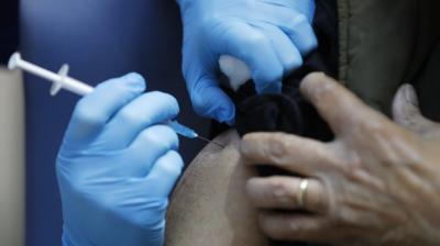 A nurse administers the Pfizer-BioNTech COVID-19 vaccine at Guy's Hospital in London, Tuesday, Dec. 8, 2020. U.K. health authorities rolled out the first doses of a widely tested and independently reviewed COVID-19 vaccine Tuesday, starting a global immunization program that is expected to gain momentum as more serums win approval. (AP)