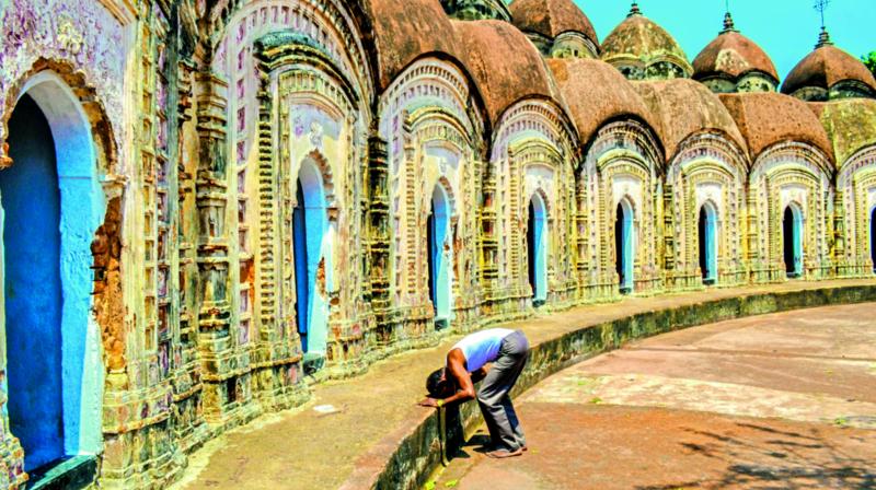 A man bows his head and prays at the Shiva Temples of Burdwan. A man bows his head and prays at the Shiva Temples of Burdwan.