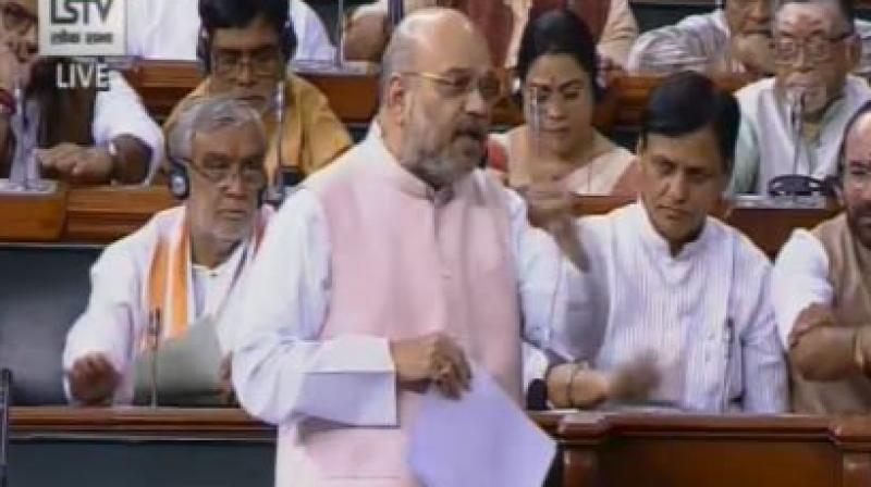 Union Home Minister Amit Shah on Friday moved the Jammu and Kashmir reservation bill in the Lok Sabha. (Photo: Twitter/ ANI) Union Home Minister Amit Shah on Friday moved the Jammu and Kashmir reservation bill in the Lok Sabha. (Photo: Twitter/ ANI)