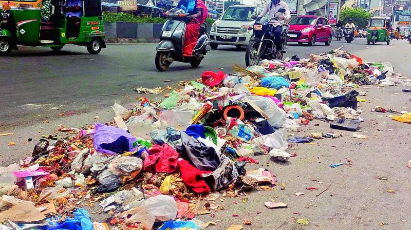 The garbage which fell during transit from the city to dumpyard lies unattended near Malakpet road. The garbage which fell during transit from the city to dumpyard lies unattended near Malakpet road.