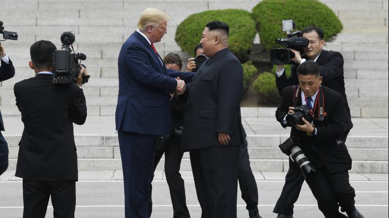 After shaking hands with Kim over the line that marks where their two countries and their allies fought each other to a standstill in the 1950-53 Korean War, Trump walked for several steps into North Korean territory, before another handshake. (Photo: AP) After shaking hands with Kim over the line that marks where their two countries and their allies fought each other to a standstill in the 1950-53 Korean War, Trump walked for several steps into North Korean territory, before another handshake. (Photo: AP)