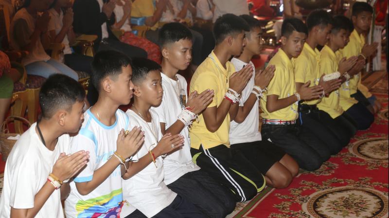 On Thursday, some of the boys and their relatives took part in religious ceremonies at Mae Sai’s Wat Pha That Doi Wao temple – an ancient temple with scenic views of the surrounding countryside. (Photo: AP) On Thursday, some of the boys and their relatives took part in religious ceremonies at Mae Sai’s Wat Pha That Doi Wao temple – an ancient temple with scenic views of the surrounding countryside. (Photo: AP)