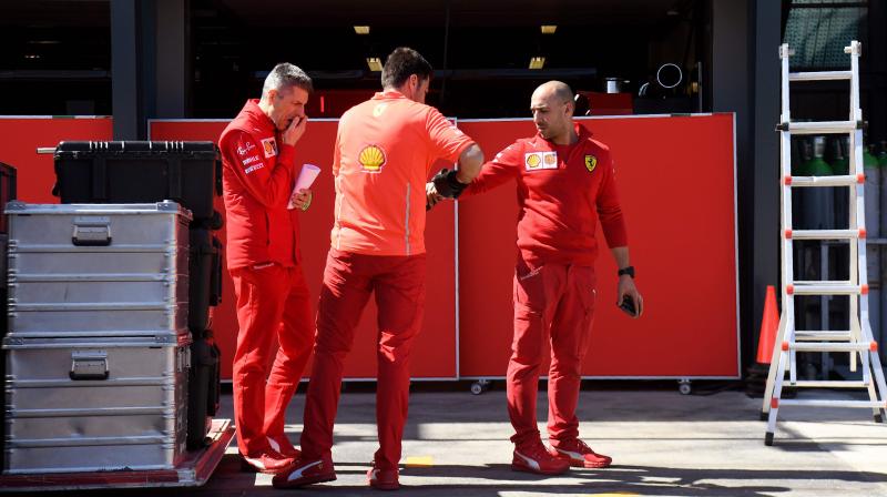 Ferrari crew members unpack equipment at the Albert Park circuit in Melbourne on Tuesday, ahead of the Formula One Australian Grand Prix. AFP Photo