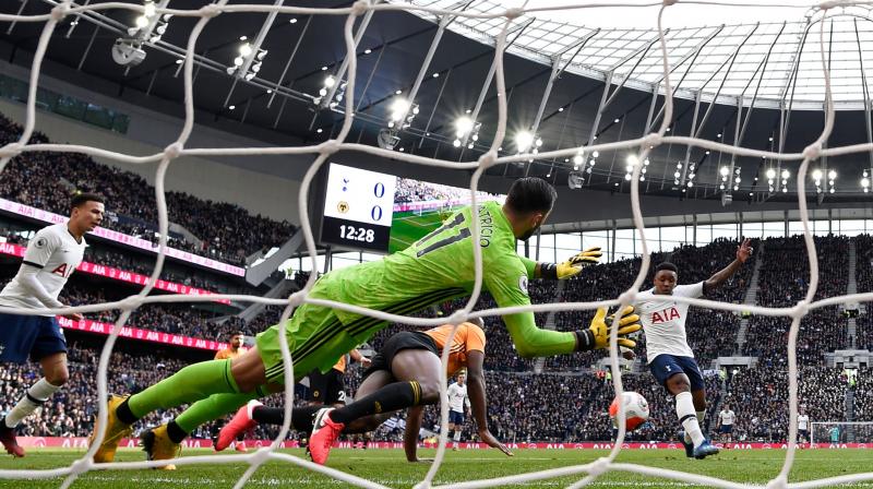 Tottenham Hotspur's Dutch midfielder Steven Bergwijn (R) slots home during the English Premier League match against Wolverhampton Wanderers on March 1. AFP Photo Tottenham Hotspur's Dutch midfielder Steven Bergwijn (R) slots home during the English Premier League match against Wolverhampton Wanderers on March 1. AFP Photo
