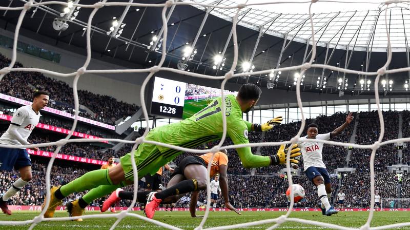 Tottenham Hotspurs Dutch midfielder Steven Bergwijn (R) slots home during the English Premier League match against Wolverhampton Wanderers on March 1. AFP Photo