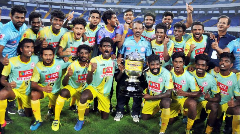 2018 Santosh Trophy champions Kerala team with the trophyby beating Bengal at Salt Lake in Kolkata on Sunday. PTI Photo (