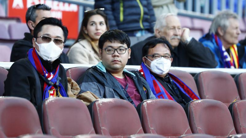 Spectators at the Camp Nou Stadium watch the Barcelona v Real Sociedad match in the Copa del Ray last Saturday. AP Photo Spectators at the Camp Nou Stadium watch the Barcelona v Real Sociedad match in the Copa del Ray last Saturday. AP Photo