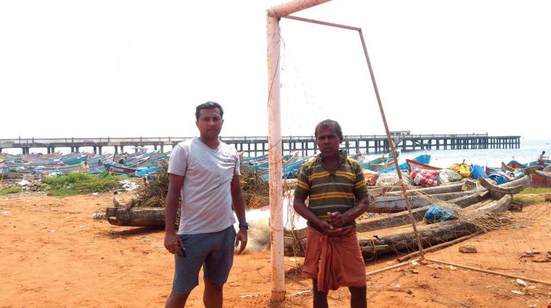 Shyam Simon, a regular who plays on Valiathura football ground, with Christopher V, say that the football net had to be shifted, after the sea ate up the coast Shyam Simon, a regular who plays on Valiathura football ground, with Christopher V, say that the football net had to be shifted, after the sea ate up the coast
