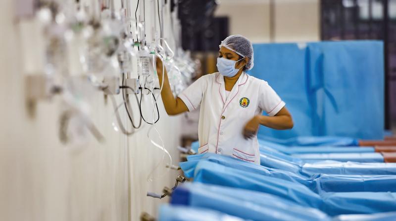 A healthworker prepares an oxygen triage facility for COVID-19 patients as coronavirus cases surge, at Omandurar Government hospital in Chennai. (Photo: PTI)