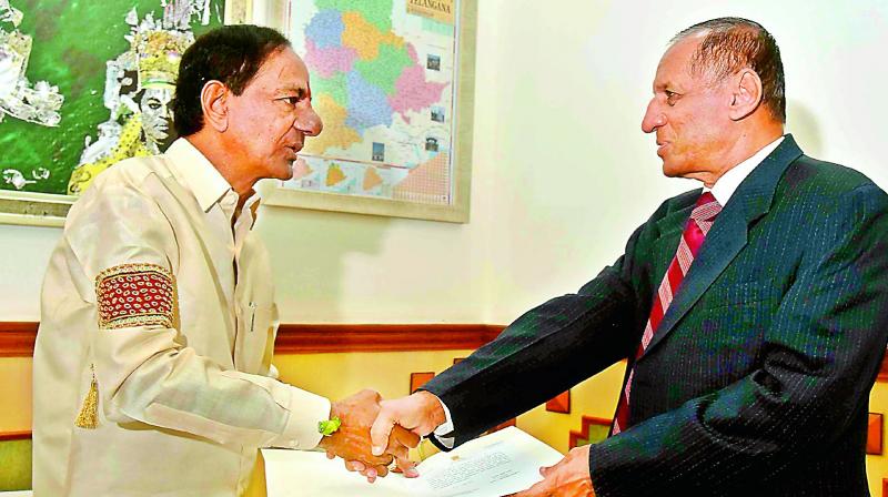 Chief Minister K. Chandrasekhar Rao presents the resolution of the council of ministers recommending the dissolution of the Telangana Legislative Assembly to Governor E.S.L. Narasimhan on Thursday. (Photo: DC) Chief Minister K. Chandrasekhar Rao presents the resolution of the council of ministers recommending the dissolution of the Telangana Legislative Assembly to Governor E.S.L. Narasimhan on Thursday. (Photo: DC)