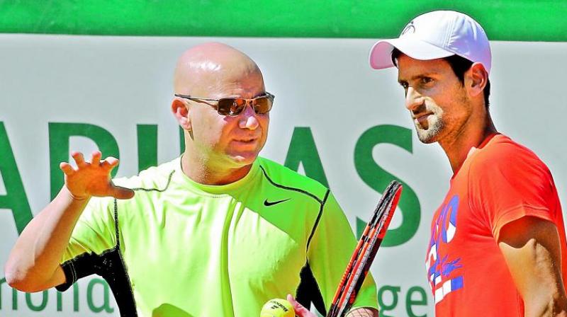 Djokovic announced that he would start working with Agassi shortly before the French Open. (Photo:AP) Djokovic announced that he would start working with Agassi shortly before the French Open. (Photo:AP)