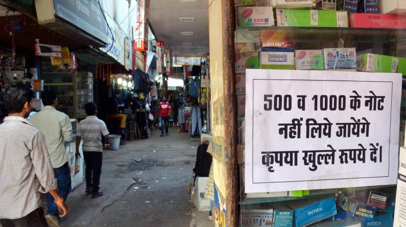 A shopkeeper pasted a notice in his shop denying to accept Rupees 500 and 1000 currency notes against selling of goods, in Bhopal. (Photo: PTI) A shopkeeper pasted a notice in his shop denying to accept Rupees 500 and 1000 currency notes against selling of goods, in Bhopal. (Photo: PTI)